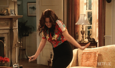 Woman Dancing In Living Room With Netflix Logo GIF