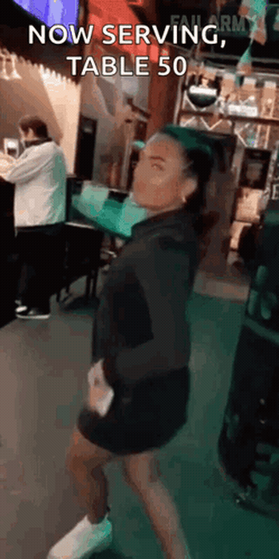 Woman Dancing In Restaurant Saying Now Serving Table 50 GIF