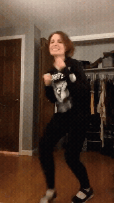 Woman Dancing In Room With C Shirt GIF