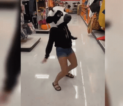 Woman Dancing In Store With Panda Mask GIF