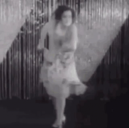 Woman Dancing In White Dress GIF
