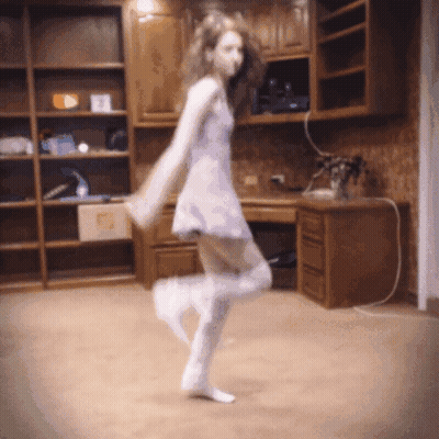 Woman Dancing In White Dress And Knee-High Socks GIF