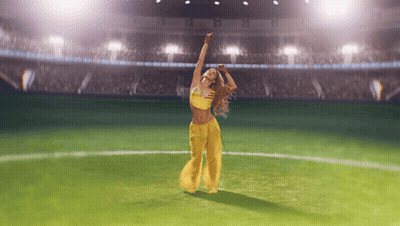 Woman Dancing On Soccer Field With Arms In Air GIF