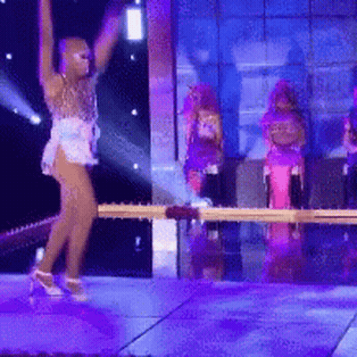 Woman Dancing On Stage Arms In Air GIF