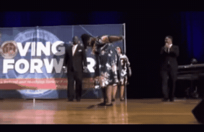 Woman Dancing On Stage Saying Moving Forward GIF