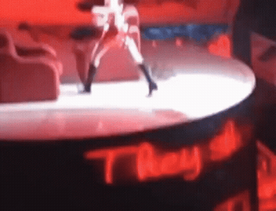 Woman Dancing On Stage With They All Sign GIF