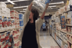 Woman Dancing While Holding Toilet Paper GIF
