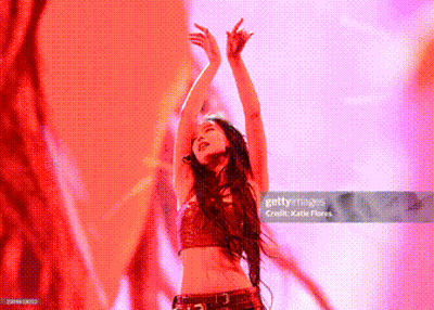 Woman Dancing With Arms In Air GIF