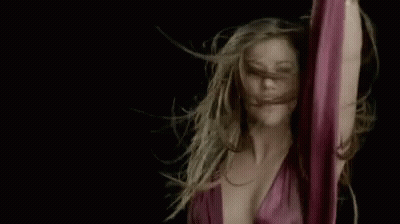 Woman Dancing With Hair Blowing In Wind GIF