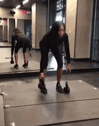 Woman Deadlifting With Mirror