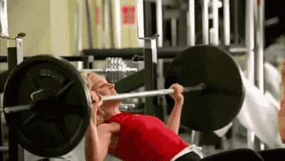 Woman Doing Bench Press In Gym GIF