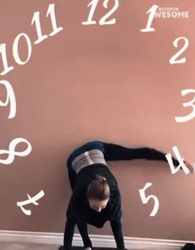 Woman Doing Handstand In Front Of Numbers Wall GIF