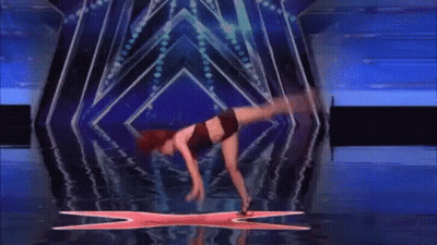 Woman Doing Handstand On Stage With X GIF