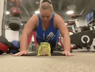 Woman Doing Push Ups With Chips GIF