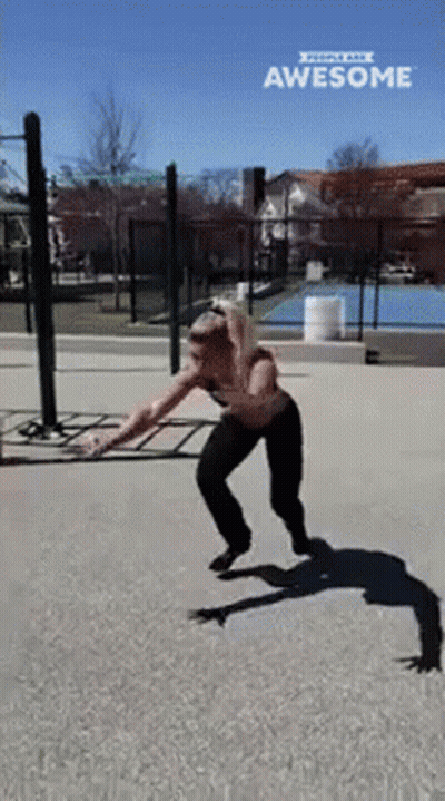 Woman Doing Skateboard Trick In Park Saying Awesome GIF