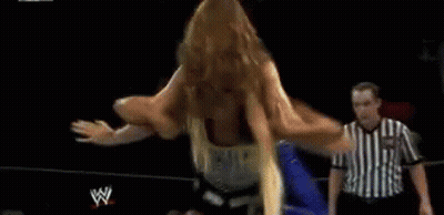 Woman Doing Split In Wrestling Ring With Referee GIF