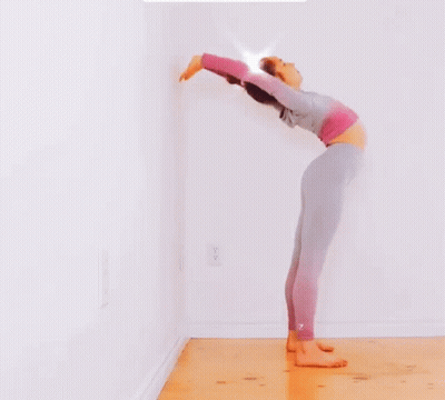 Woman Doing Yoga Pose Against Wall GIF