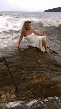 Woman Dragged By Strong Wave Funny Beach GIF