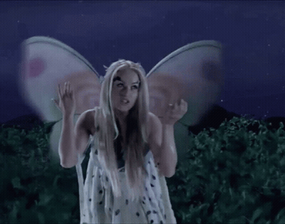 Woman Dressed As Fairy With Wings On Head GIF