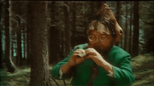 Woman Dressed As Santa Dancing In Kitchen GIF