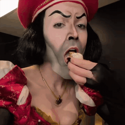 Woman Dressed As Shrek Eating Cake GIF