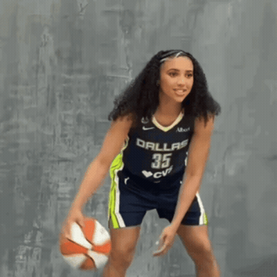 Woman Dribbling Basketball Past Man In Blue HCJB Shirt GIF