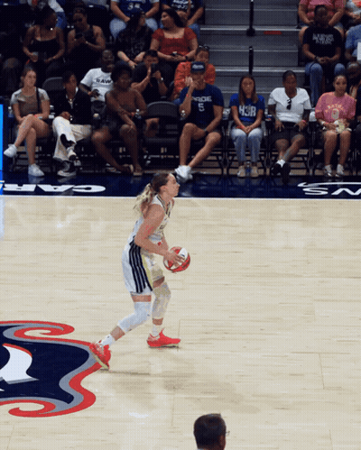 Woman Dribbling Basketball Past Man In HCJB Shirt GIF