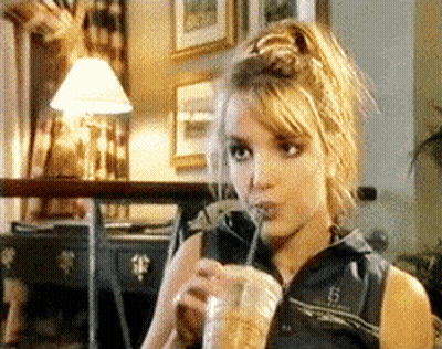 Woman Drinking Beverage Through Straw GIF