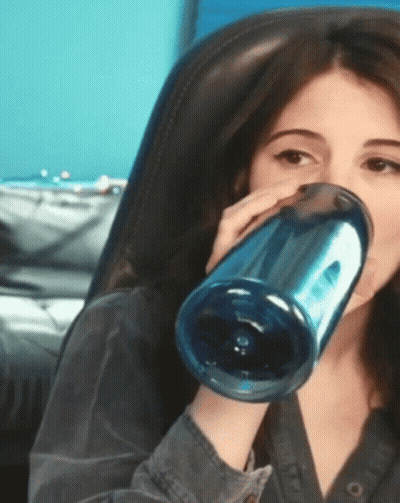 Woman Drinking From Blue Bottle GIF