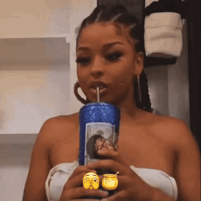 Woman Drinking From Blue Cup With Smiley Face GIF