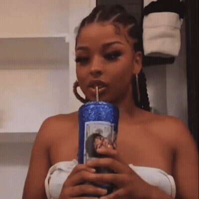 Woman Drinking From Blue Tumbler With Straw GIF