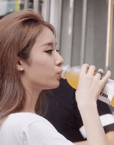 Woman Drinking From Bottle Saying Bia GIF