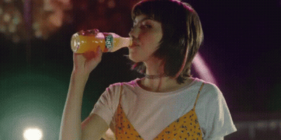 Woman Drinking From Fanta Bottle GIF