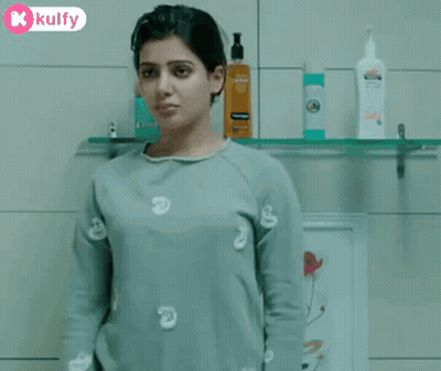 Woman Drinking From Glass In Bathroom GIF