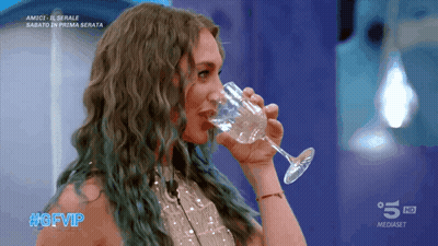 Woman Drinking From Glass With #Gfvip GIF
