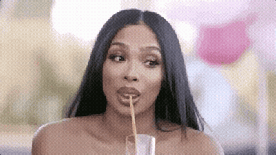 Woman Drinking From Glass With Straw GIF
