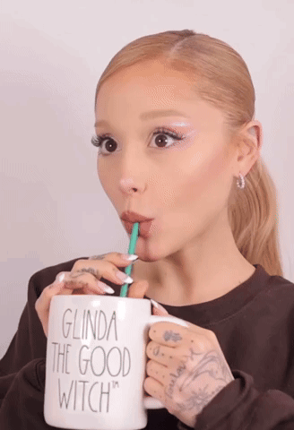Woman Drinking From Glinda The Good Witch Mug GIF