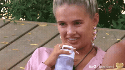 Woman Drinking From Itv 2 Love Island Bottle GIF
