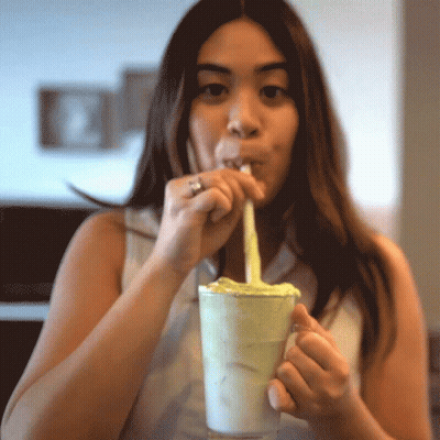 Woman Drinking Milkshake Through Straw With Ring GIF