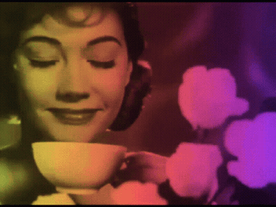 Woman Drinking Tea With Flowers GIF