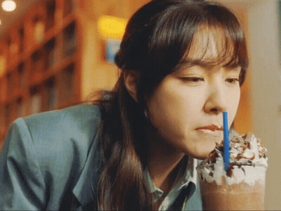 Woman Drinking Through Blue Straw GIF