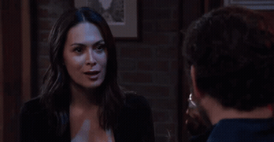 Woman Drinking Through Straw At Table GIF