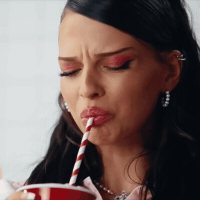 Woman Drinking Through Straw From Cup GIF