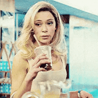 Woman Drinking Through Straw Holding Pitcher GIF