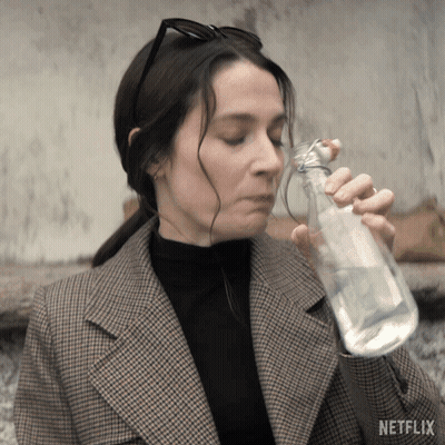 Woman Drinking Water From Bottle With Netflix Logo GIF