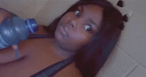 Woman Drinking Water Lying Down GIF