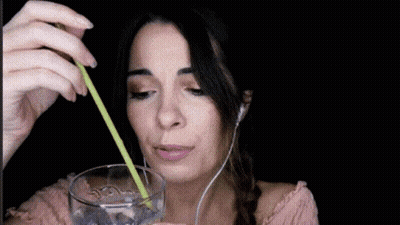 Woman Drinking Water With Straw And Headphones GIF
