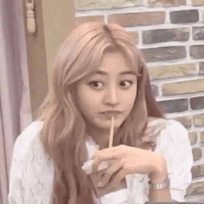 Woman Drinking With Straw At Table GIF