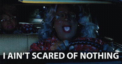 Woman Driving Car Saying I Ain't Scared of Nothing