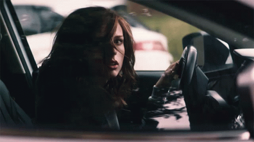 Woman Driving Car Talking On Phone GIF